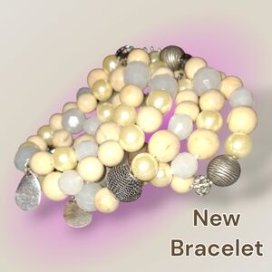 NWOT blue, cream, and Silver Beaded multistrand bohemian stretch bracelet